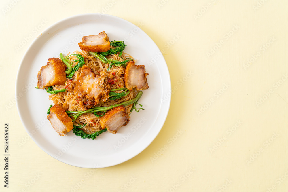 Stir-fried rice vermicelli and water mimosa with crispy pork belly