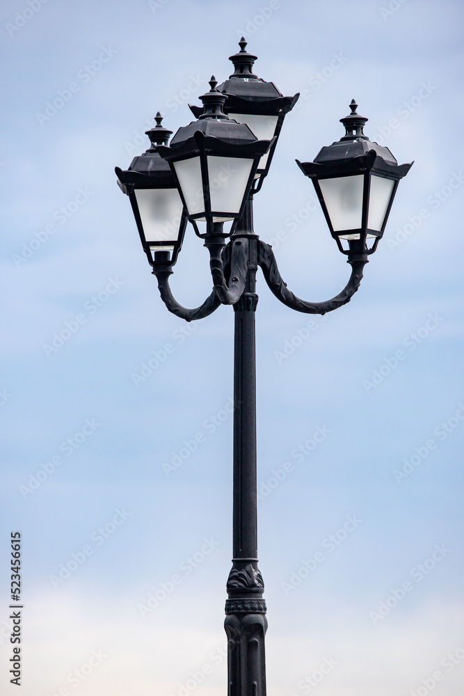 Street lamps against the sky. Energy crisis, save electricity.