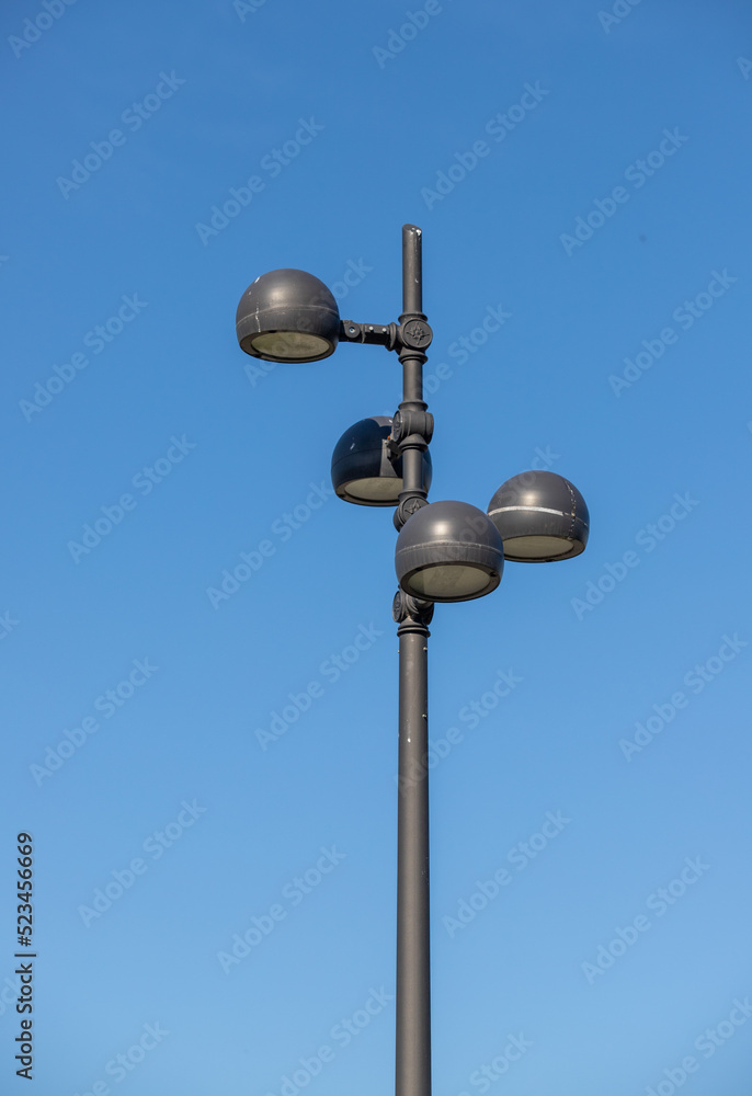 Street lamps against the sky. Energy crisis, save electricity.