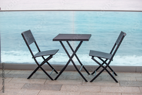 Tables chairs on the street along the promenade