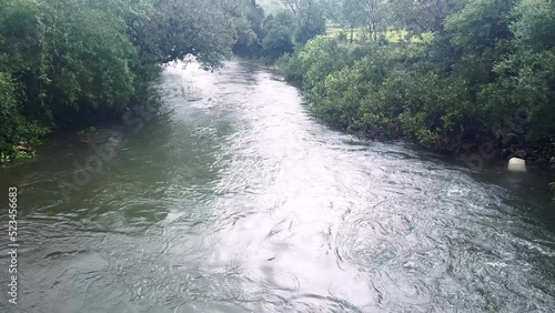 Water flowing down in a seasonal stream during the monsoon season at Tamhini near Pune India. Monsoon is the annual rainy season in India from June to September. photo