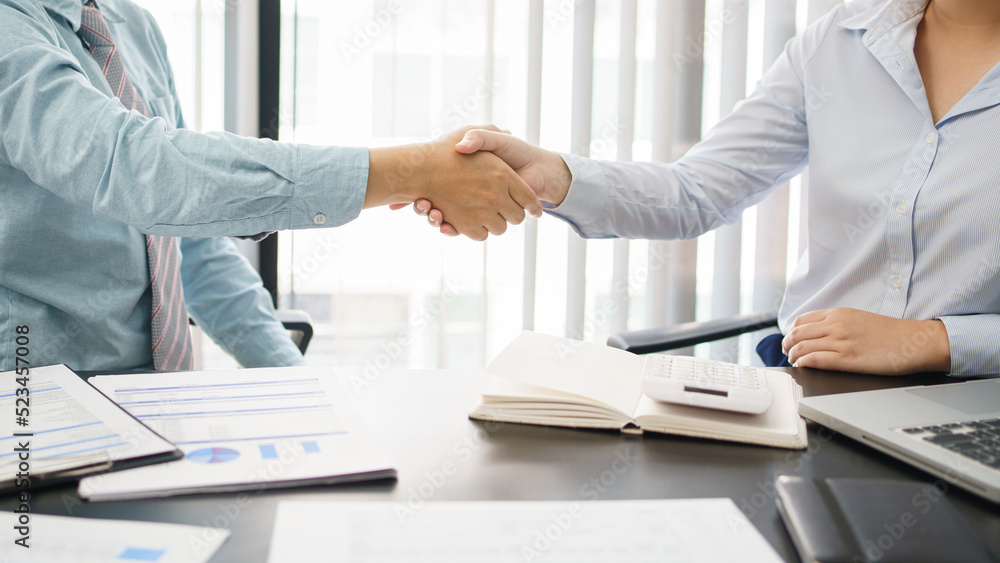 Business concept, Business colleagues shaking hands together after working successfully Business concept, Business colleagues shaking hands together after working successfully