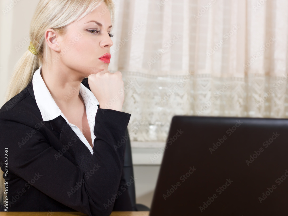 portrait of a businesswoman working on a computer portrait of a businesswoman working on a computer