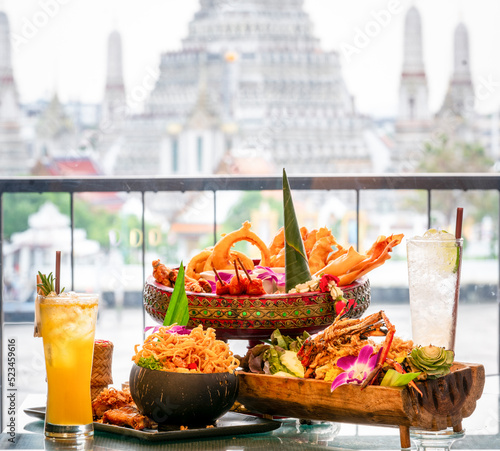 Thai food with Arun temple background photo