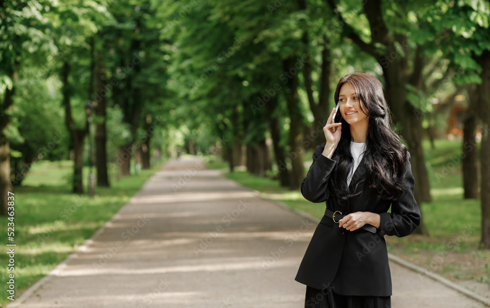 Business woman talking on smart phone. Caucasian female professional outside. Business woman talking on smart phone. Caucasian female professional outside.