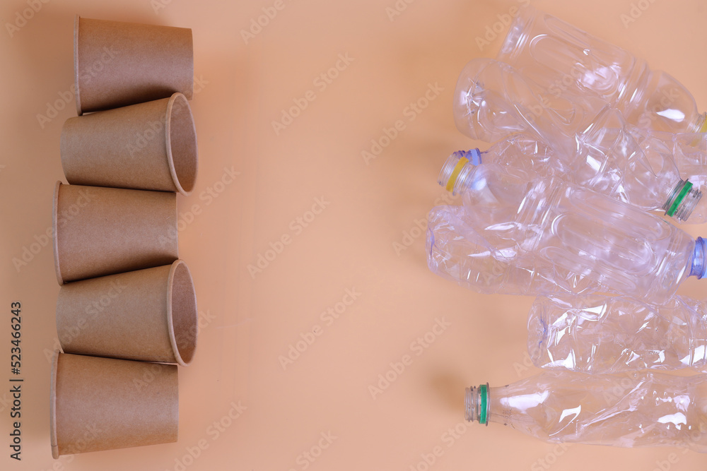 Ecofriendly paper cups vs plastic bottles. Zero waste home, plastic