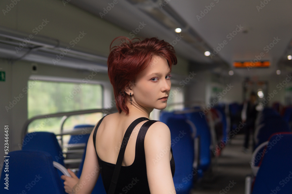 Obraz premium teenager girl in a commuter train car