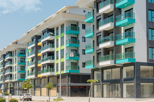 фотографія Modern freshly built apartment buildings on a sunny day with blue sky