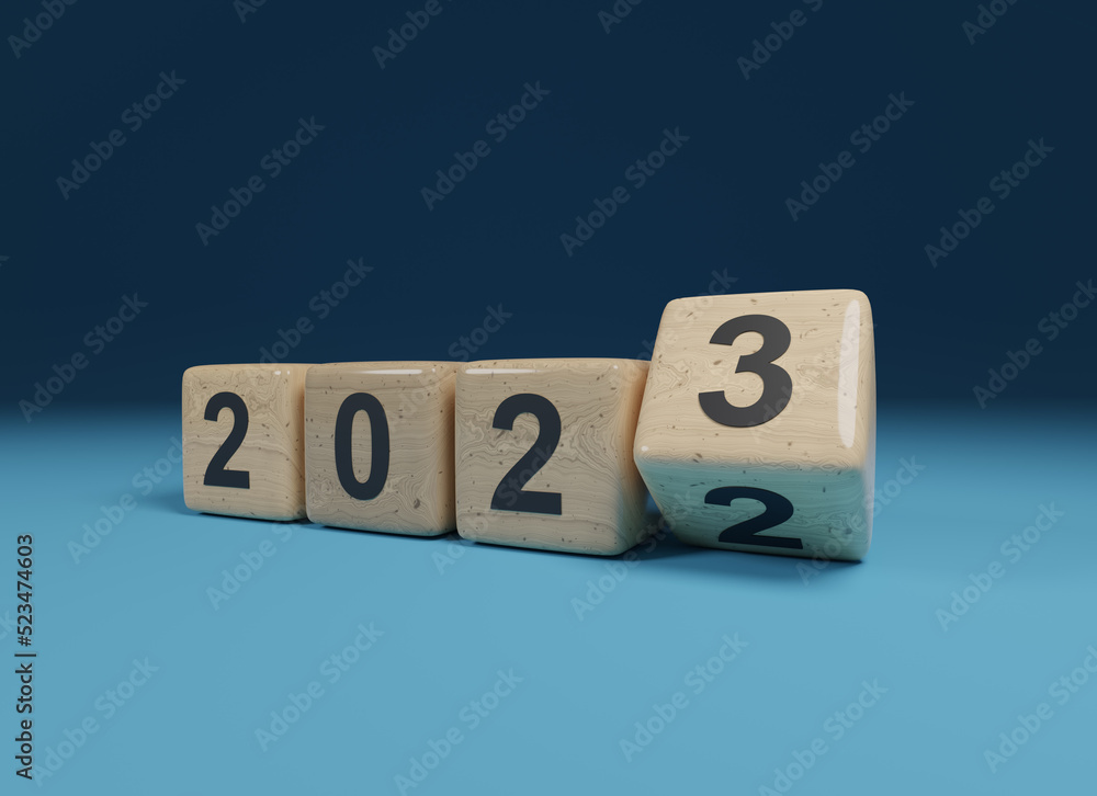 Flipping wooden cubes with the Year number 2022 and 2023, New Year concept Flipping wooden cubes with the Year number 2022 and 2023, New Year concept