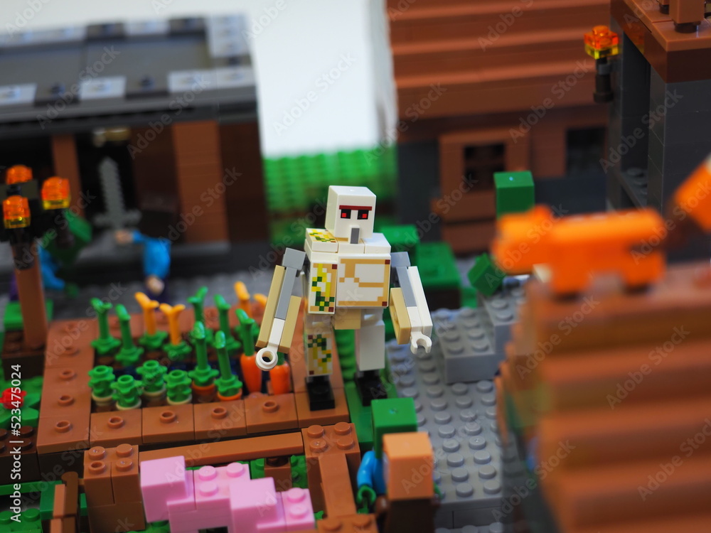 Obraz premium Elements and fragments of Lego village world set. Characters of electronic game Minecraft. Children's designer with small details, developing motor skills and imagination.