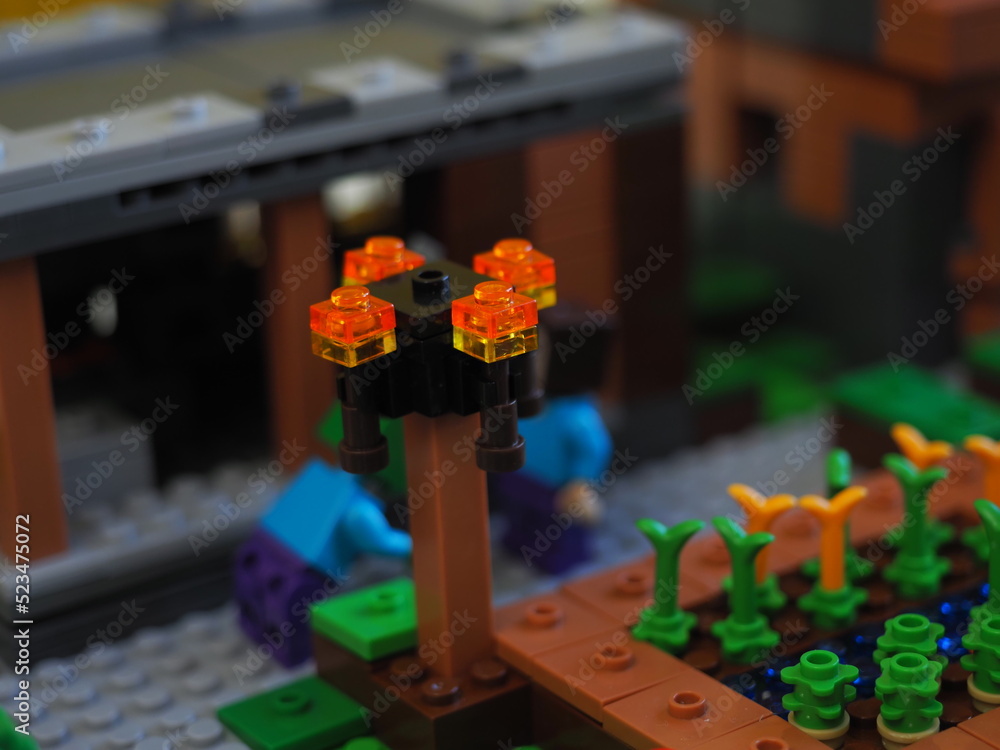 Fototapeta premium Elements and fragments of Lego village world set. Characters of electronic game Minecraft. Children's designer with small details, developing motor skills and imagination.