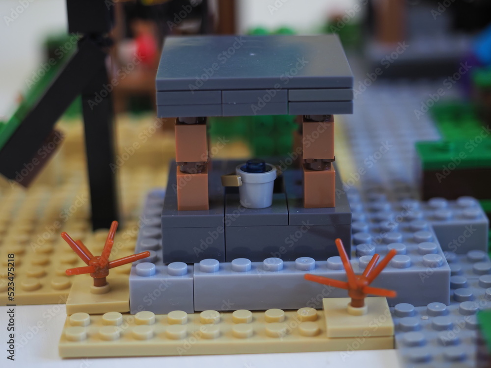Fototapeta premium Elements and fragments of Lego village world set. Characters of electronic game Minecraft. Children's designer with small details, developing motor skills and imagination.