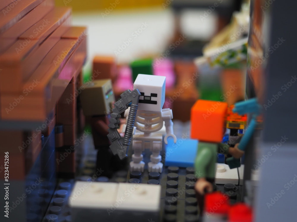 Naklejka premium Elements and fragments of Lego village world set. Characters of electronic game Minecraft. Children's designer with small details, developing motor skills and imagination.