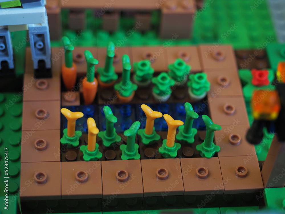 Fototapeta premium Elements and fragments of Lego village world set. Characters of electronic game Minecraft. Children's designer with small details, developing motor skills and imagination.