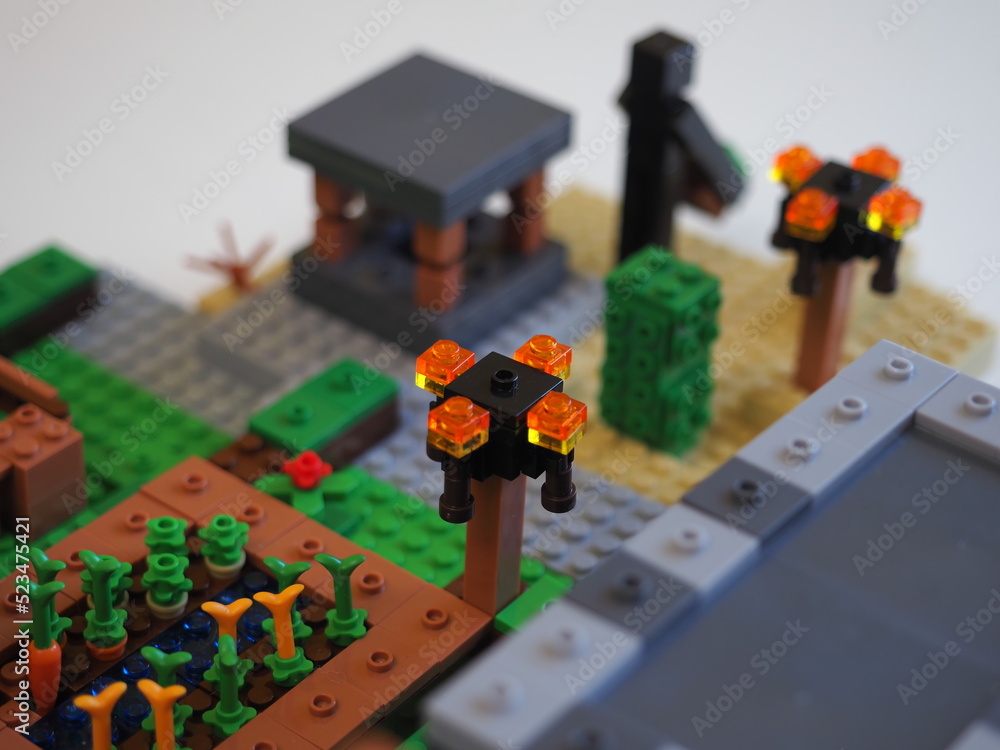 Naklejka premium Elements and fragments of Lego village world set. Characters of electronic game Minecraft. Children's designer with small details, developing motor skills and imagination.