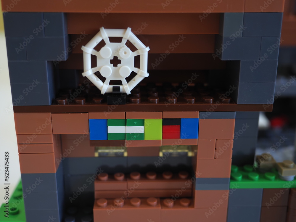 Naklejka premium Elements and fragments of Lego village world set. Characters of electronic game Minecraft. Children's designer with small details, developing motor skills and imagination.