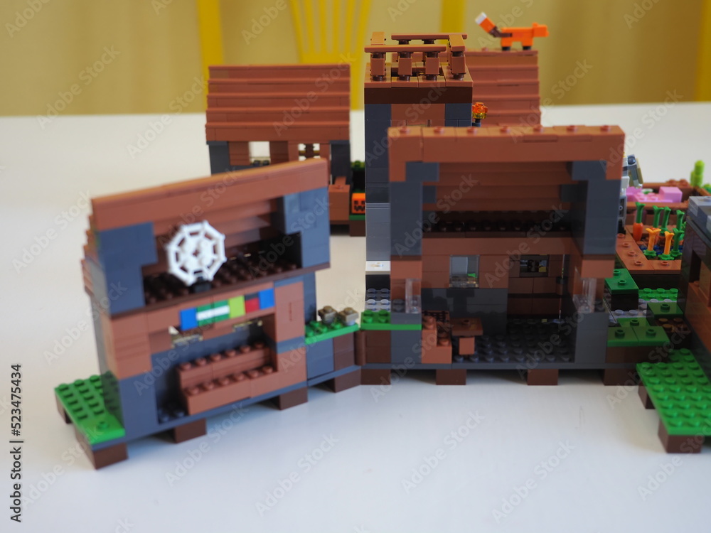 Naklejka premium Elements and fragments of Lego village world set. Characters of electronic game Minecraft. Children's designer with small details, developing motor skills and imagination.