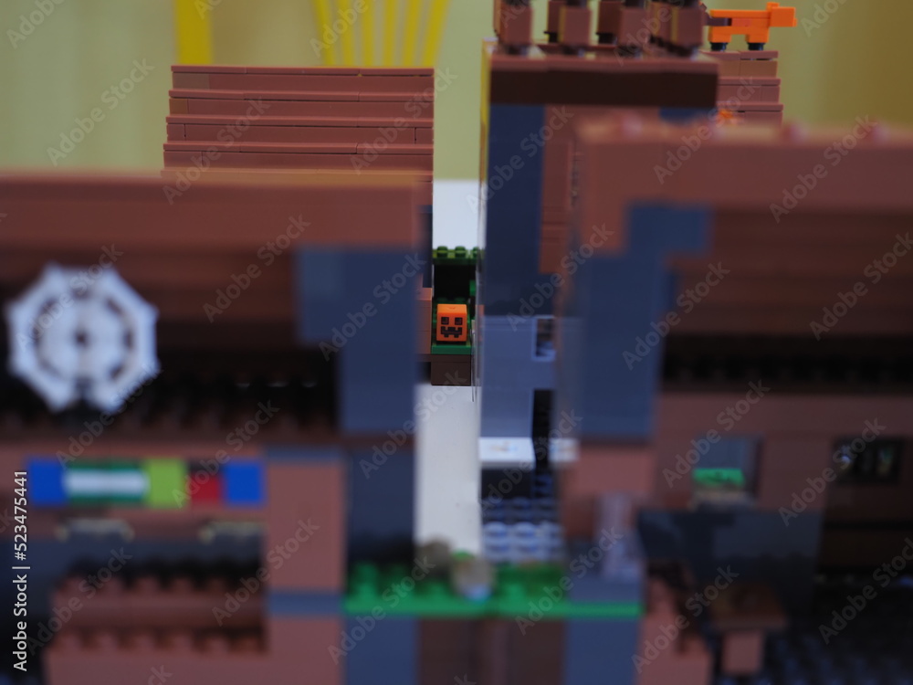 Naklejka premium Elements and fragments of Lego village world set. Characters of electronic game Minecraft. Children's designer with small details, developing motor skills and imagination.