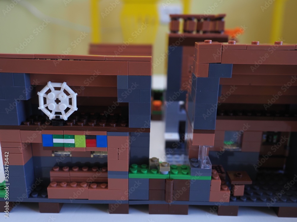 Fototapeta premium Elements and fragments of Lego village world set. Characters of electronic game Minecraft. Children's designer with small details, developing motor skills and imagination.