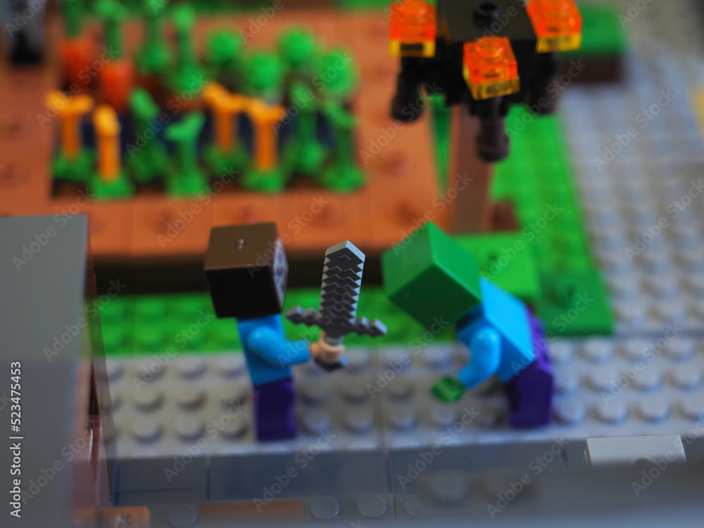 Fototapeta premium Elements and fragments of Lego village world set. Characters of electronic game Minecraft. Children's designer with small details, developing motor skills and imagination.