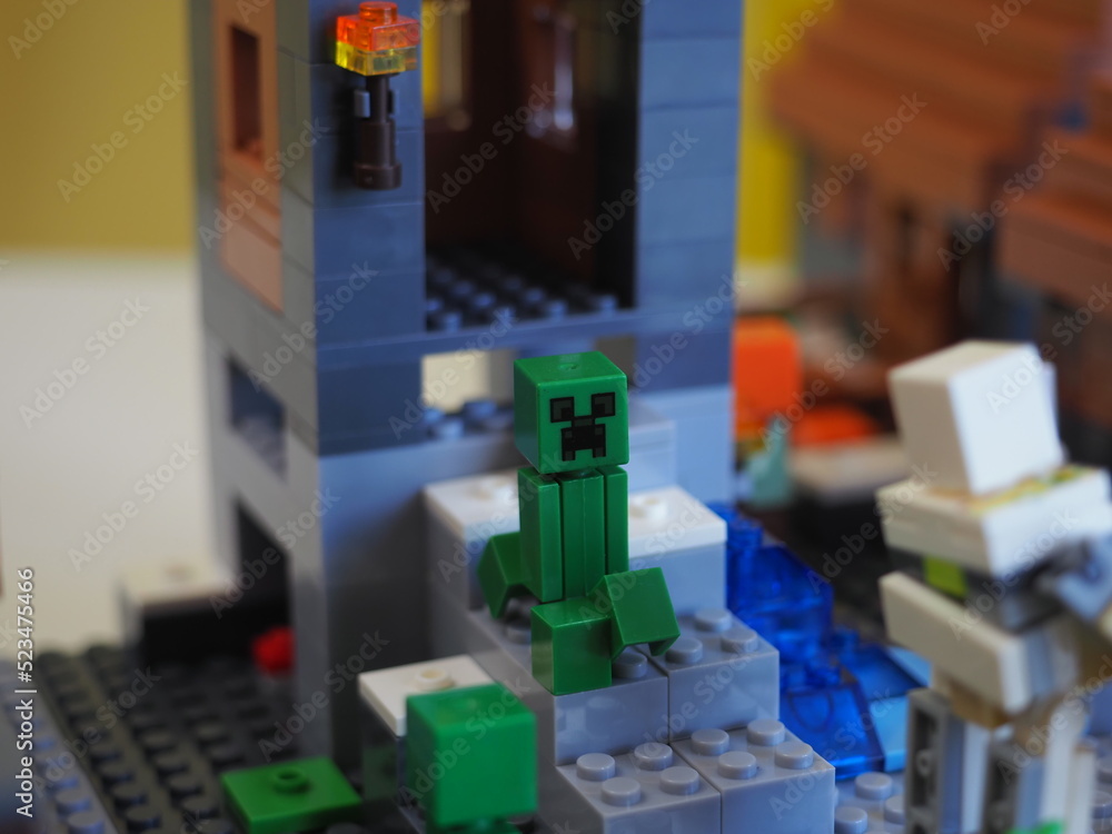Naklejka premium Elements and fragments of Lego village world set. Characters of electronic game Minecraft. Children's designer with small details, developing motor skills and imagination.