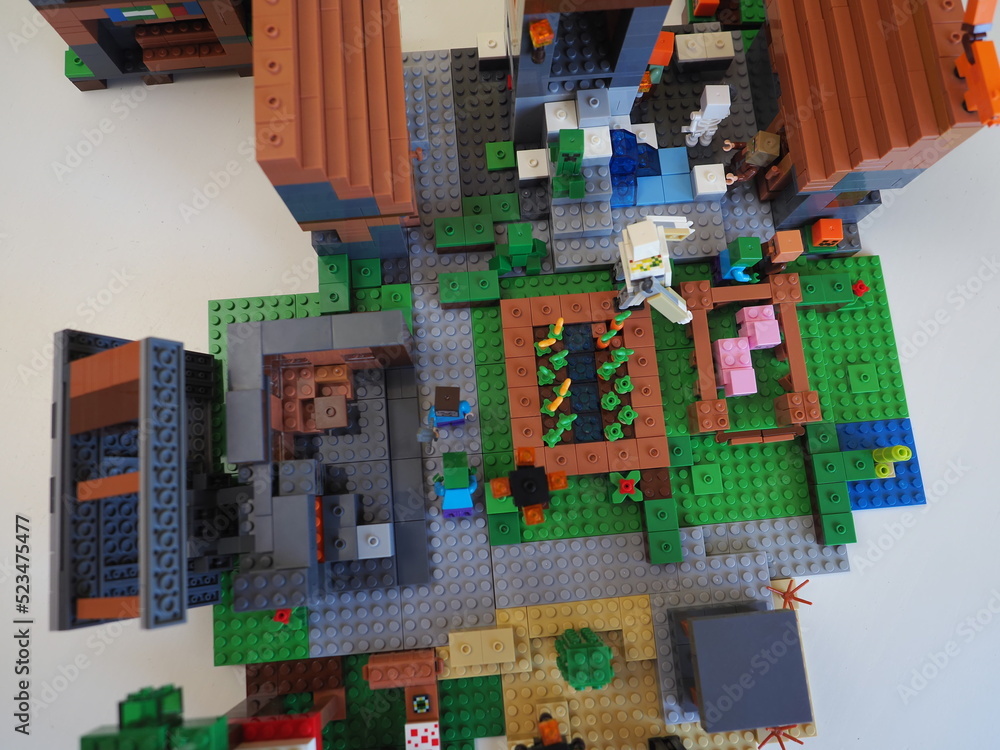 Fototapeta premium Elements and fragments of Lego village world set. Characters of electronic game Minecraft. Children's designer with small details, developing motor skills and imagination.