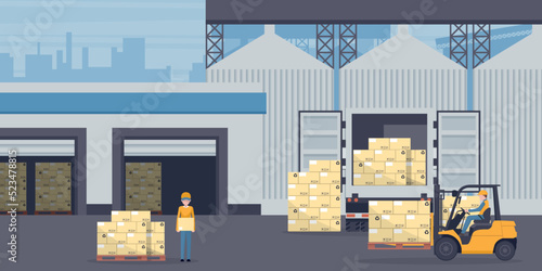 Forklift unloading pallet from cargo container or refrigerated truck to an industrial warehouse. Industrial storage and distribution of products