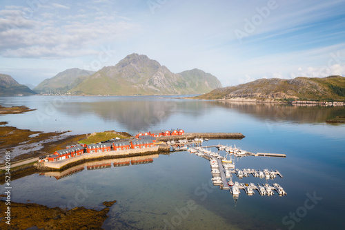 Aerial view of red cabins in Leknes in Lofoten - Norway at sunrise. Panorama of typical Norwegian houses photo