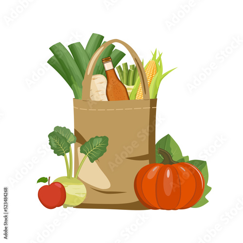 Textile linen shopping bag with farmers market vegan autumn vegetables, pumpkin, roots and apple cider bottle. Reusable recyclable plastic free shopper