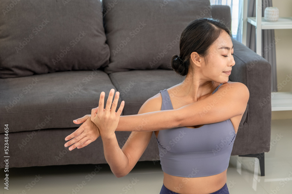 Asian people practicing yoga lifestyle class on a mat at living room. Asian people practicing yoga lifestyle class on a mat at living room.