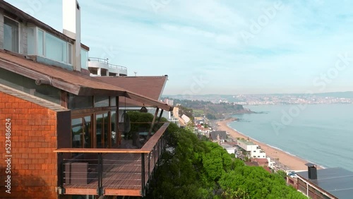 Aerial view Reñaca beachside house balcony dolly out luxury home day photo