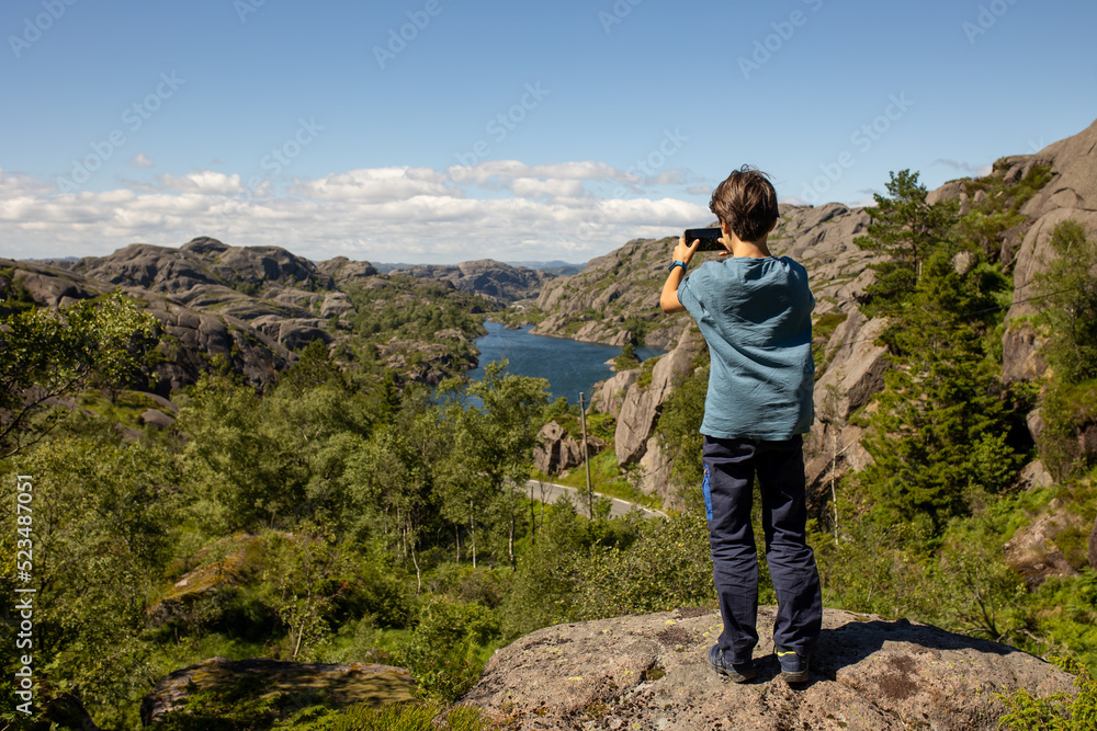 Happy people, enjoying amazing views in South Norway coastline, fjords, lakes, beautiful nature