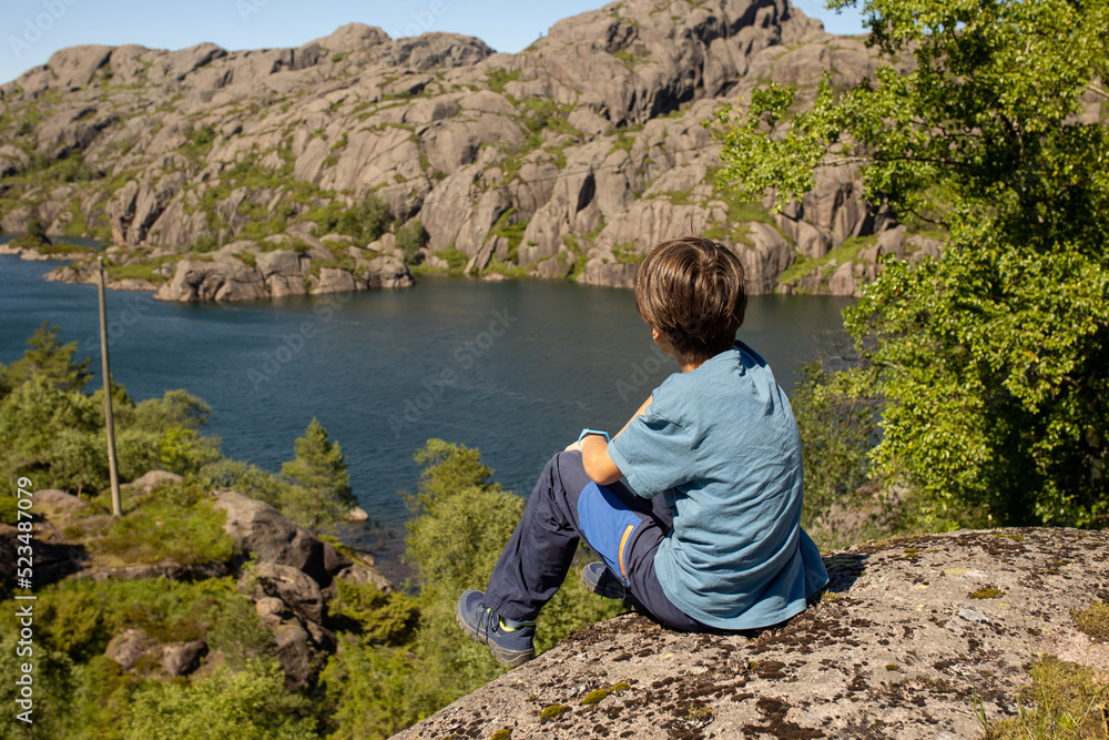 Naklejka premium Happy people, enjoying amazing views in South Norway coastline, fjords, lakes, beautiful nature