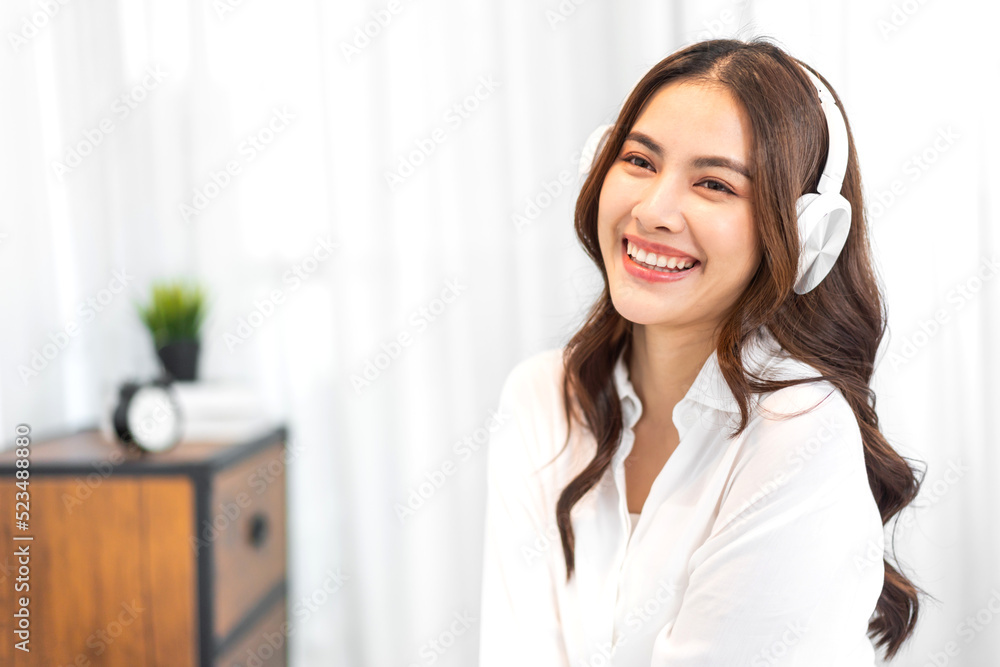 Portrait of big smiling happy beautiful pretty asian woman clean fresh healthy white skin posing smile in pajamas white clothes.Girl felling relax and enjoy time on the bed at home.asia beauty Portrait of big smiling happy beautiful pretty asian woman clean fresh healthy white skin posing smile in pajamas white clothes.Girl felling relax and enjoy time on the bed at home.asia beauty