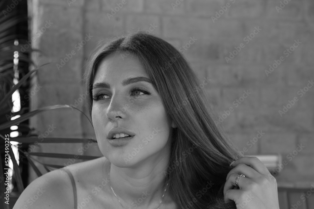 Fototapeta premium Portrait of a beautiful woman in black and white