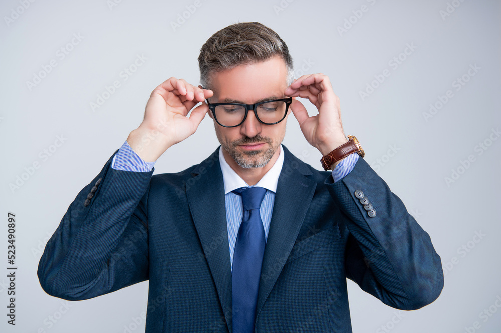 confident mature entrepreneur in businesslike suit on grey background confident mature entrepreneur in businesslike suit on grey background