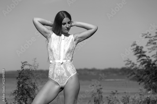 Woman in lingerie outdoors in black and white
