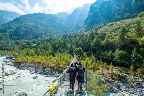 Hikers on the way from Lukla to Namche Bazar on the trek to the Everest Base Camp, Nepal. photo