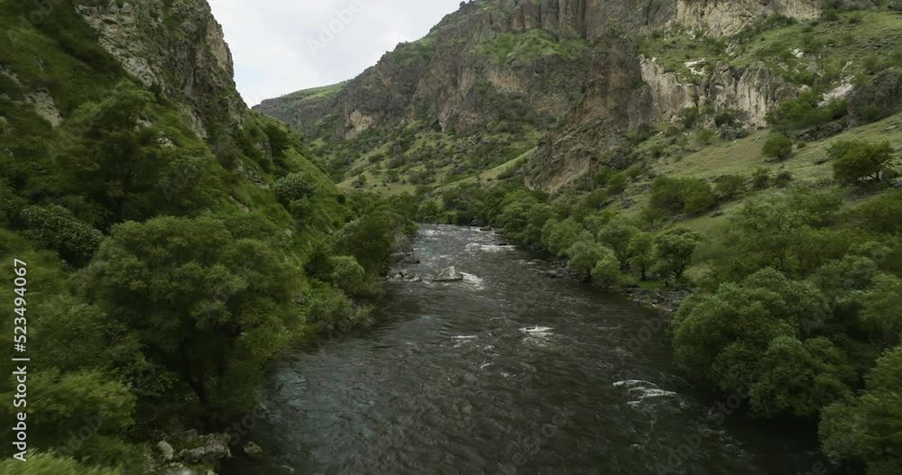 Paravani Estuary Flowing In Rocky Steep Caucasus Mountains Near Khertvisi In Aspindza Municipality, Southern Georgia. Aerial Drone Shot Paravani Estuary Flowing In Rocky Steep Caucasus Mountains Near Khertvisi In Aspindza Municipality, Southern Georgia. Aerial Drone Shot