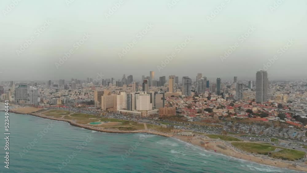 Aerial view of Tel aviv beaches and charles clore park at sunset, Summer time with haze in the air Aerial view of Tel aviv beaches and charles clore park at sunset, Summer time with haze in the air