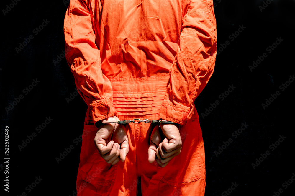 Handcuffs On Accused Criminal In Orange Jail Jumpsuit Law Offender Handcuffs On Accused Criminal In Orange Jail Jumpsuit Law Offender