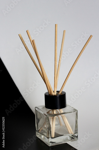 home diffuser with incense sticks on blue and white background