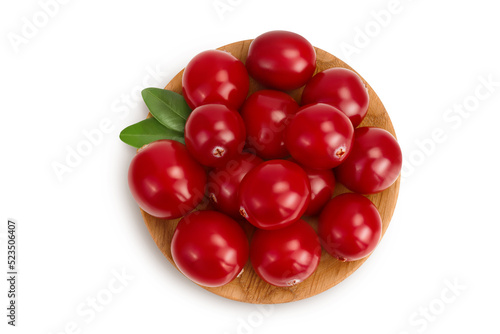 Cranberry in wooden bowl isolated on white background with full depth of field. Top view. Flat lay