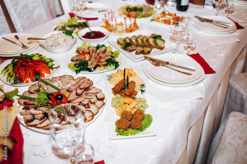 Banquet table with exquisite meat and fish dishes