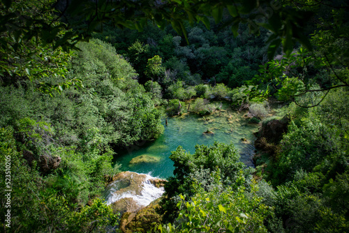 Croatia, turquoise wellspring and waterfall hidden in the woods