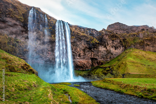 Seljalandfoss waterfall and green lawn in Iceland