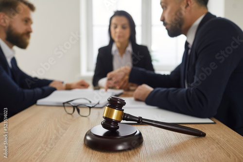 Photos Closeup focus on gavel in lawyer office
