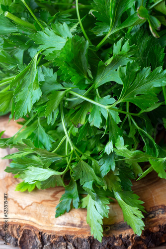 Fresh parsley on the wooden background