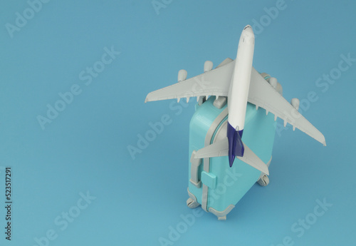 Airplane model on suitcase with room for text