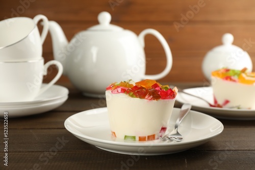 Delicious broken glass jelly dessert on wooden table